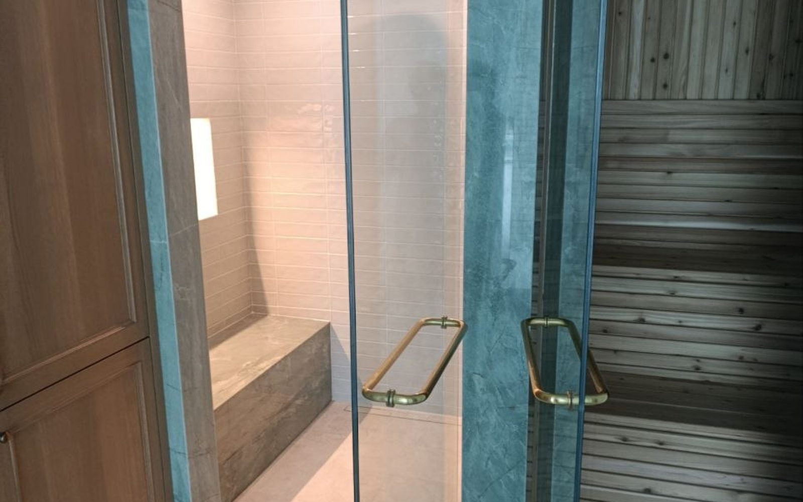 Finished spa bathroom built by Lions Group: glass steam shower with a stone bench beside a cedar sauna, framed by green stone columns